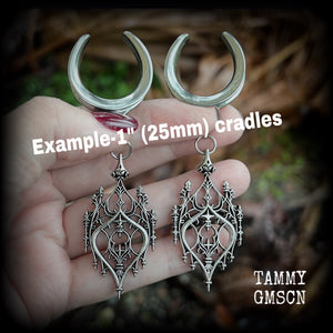These gorgeous gothic ear hangers feature a beautiful antique silver ornate gothic cathedral chandelier, measuring just on 8cms from tip to tip, and weighing approx 10 grams each. This pair has been made on 1” (25mm) surgical steel cradles.