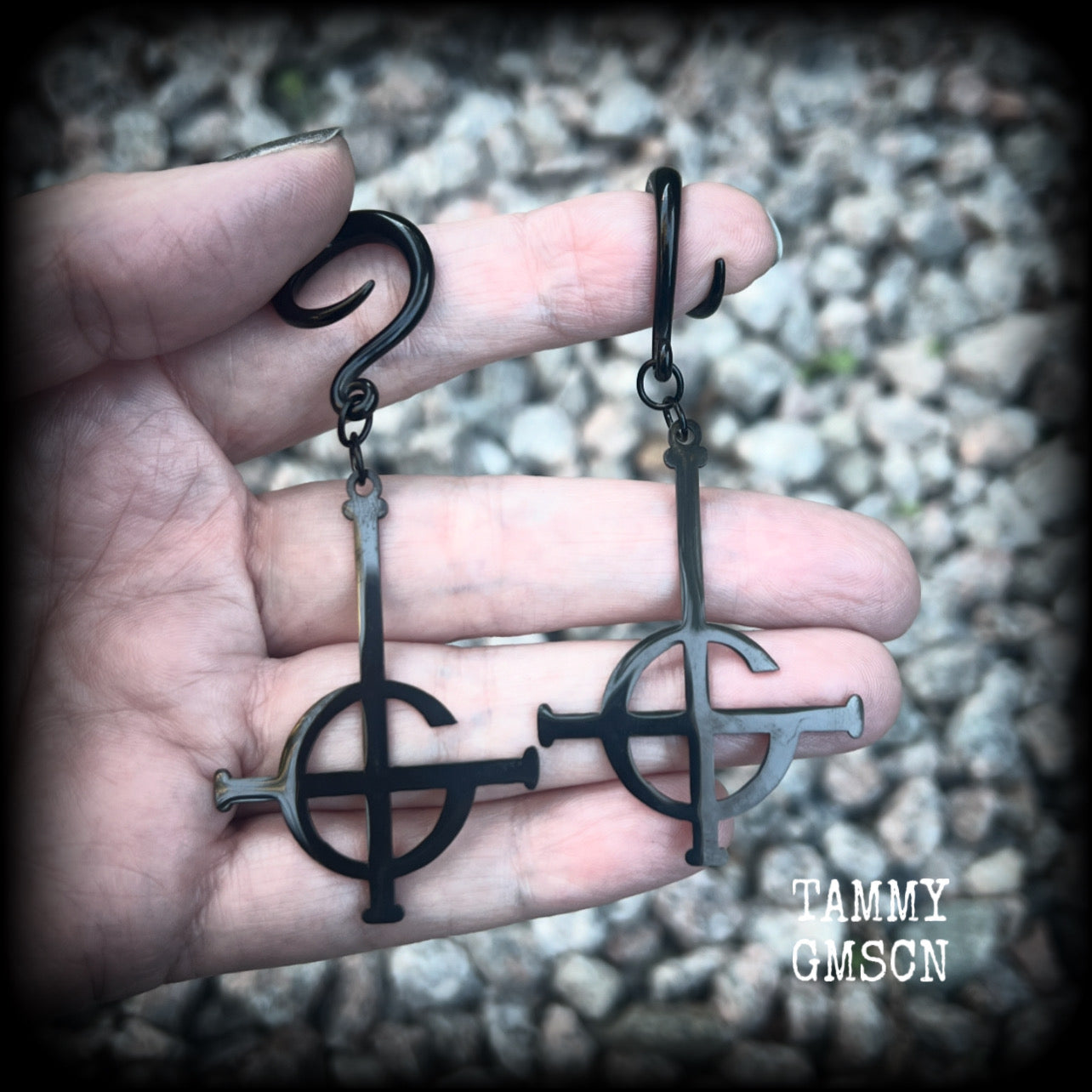 These awesome gauged earrings feature pitch black stainless steel Ghost Grucifix charms, are nice and lightweight, weighing only 6 grams a piece, and nice and dangly at just over 8cms from tip to tip.

This pair has been made on 6 gauge (4mm) surgical steel full curl hooks, suitable for stretched lobes.