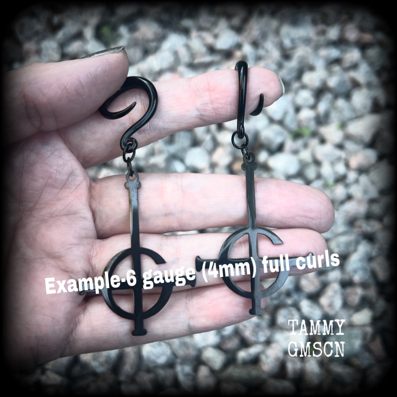 These awesome gauged earrings feature pitch black stainless steel Ghost Grucifix charms, are nice and lightweight, weighing only 6 grams a piece, and nice and dangly at just over 8cms from tip to tip.

This pair has been made on 6 gauge (4mm) surgical steel full curl hooks, suitable for stretched lobes.