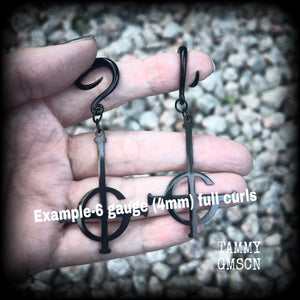These awesome gauged earrings feature pitch black stainless steel Ghost Grucifix charms, are nice and lightweight, weighing only 6 grams a piece, and nice and dangly at just over 8cms from tip to tip.

This pair has been made on 6 gauge (4mm) surgical steel full curl hooks, suitable for stretched lobes.