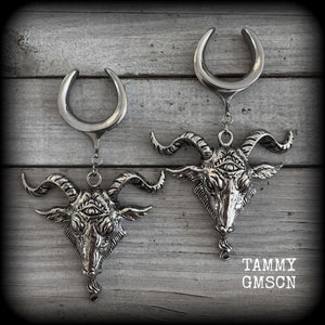 Featuring beautiful big antique silver Baphomet goat pendants, these gauged earrings measure just over 10cms from tip to tip, and weigh approx 28 grams each.

This pair have been made on 1" gauge (25mm) surgical steel cradles hooks, to be worn in stretched lobes.