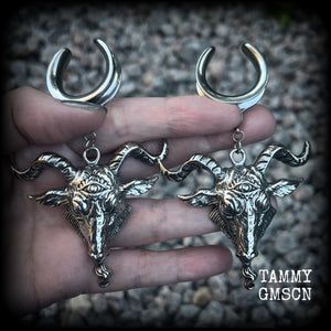 Featuring beautiful big antique silver Baphomet goat pendants, these gauged earrings measure just over 10cms from tip to tip, and weigh approx 28 grams each.

This pair have been made on 1" gauge (25mm) surgical steel cradles hooks, to be worn in stretched lobes.