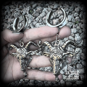 Featuring beautiful big antique silver Baphomet goat pendants, these gauged earrings measure just over 10cms from tip to tip, and weigh approx 28 grams each.

This pair have been made on 1" gauge (25mm) surgical steel cradles hooks, to be worn in stretched lobes.