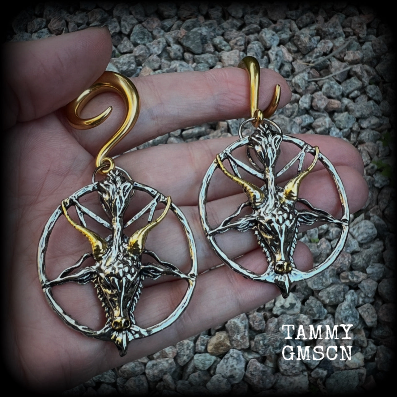 These gorgeous antique silver and gold Baphomet gauged earrings and are nice and dangly and nice and big, measuring 8cms from tip to tip, but not too heavy at only 16 grams each.

This pair has been made on 2 gauge (6mm) surgical steel full curl hooks, to be worn in stretched lobes..