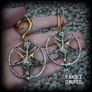 These gorgeous antique silver and gold Baphomet gauged earrings and are nice and dangly and nice and big, measuring 8cms from tip to tip, but not too heavy at only 16 grams each.

This pair has been made on 2 gauge (6mm) surgical steel full curl hooks, to be worn in stretched lobes..
