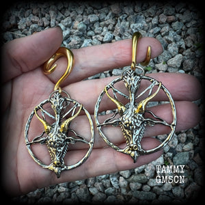 These gorgeous antique silver and gold Baphomet gauged earrings and are nice and dangly and nice and big, measuring 8cms from tip to tip, but not too heavy at only 16 grams each.

This pair has been made on 2 gauge (6mm) surgical steel full curl hooks, to be worn in stretched lobes..