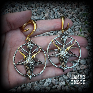 These gorgeous antique silver and gold Baphomet gauged earrings and are nice and dangly and nice and big, measuring 8cms from tip to tip, but not too heavy at only 16 grams each.

This pair has been made on 2 gauge (6mm) surgical steel full curl hooks, to be worn in stretched lobes..