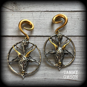These gorgeous antique silver and gold Baphomet gauged earrings and are nice and dangly and nice and big, measuring 8cms from tip to tip, but not too heavy at only 16 grams each.

This pair has been made on 2 gauge (6mm) surgical steel full curl hooks, to be worn in stretched lobes..