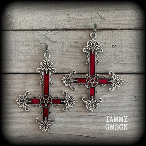 These gorgeous gothic earrings feature a red enamel inverted cross with a silver inverted pentagram, measuring just on 8.5 cms from tip to tip,  and weigh approx 10 grams a piece.

This pair have been made on stainless steel french hooks, suitable for pierced ears.
