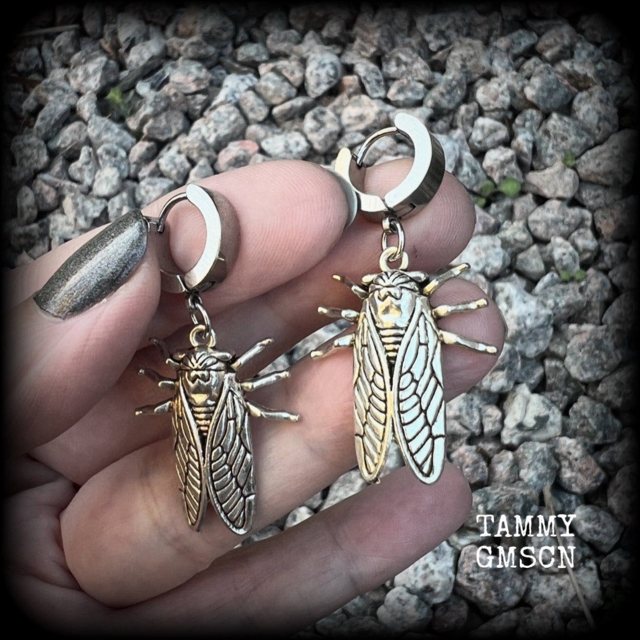 These awesome antique silver cicada earrings are nice and lightweight at 3 grams each, and measure in at approx 4.5cms from tip to tip. This pair have been made on stainless steel huggie ear cuffs, suitable for pierced ears.