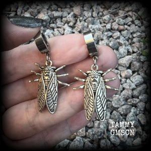 These awesome antique silver cicada earrings are nice and lightweight at 3 grams each, and measure in at approx 4.5cms from tip to tip. This pair have been made on stainless steel huggie ear cuffs, suitable for pierced ears.