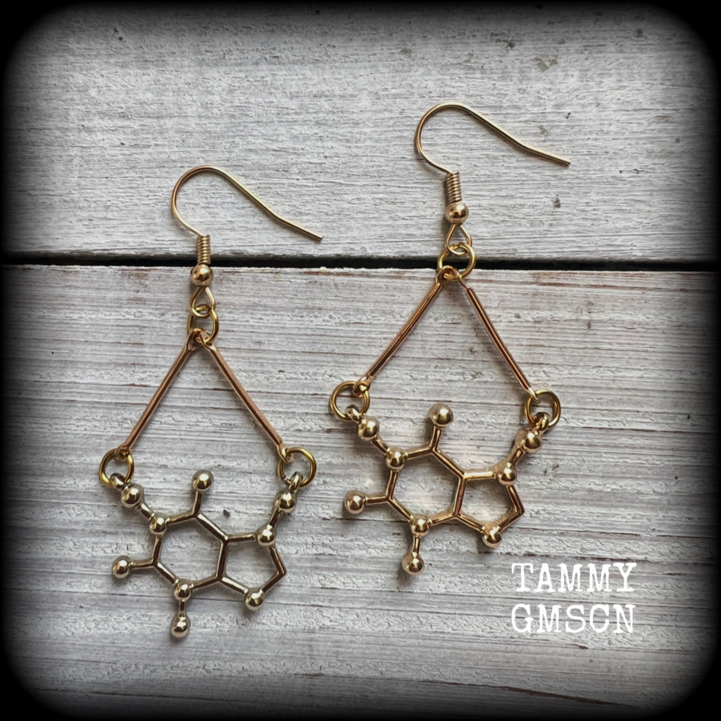 These cute champagne gold earrings feature Theobromine molecules, measuring just on 6cms from tip to tip, and weighing only a few grams each.

This pair have been made with antique gold french hooks, suitable for pierced ears.