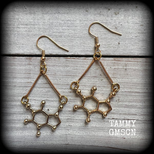 These cute champagne gold earrings feature Theobromine molecules, measuring just on 6cms from tip to tip, and weighing only a few grams each.

This pair have been made with antique gold french hooks, suitable for pierced ears.