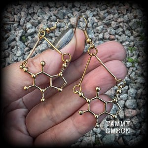 These cute champagne gold earrings feature Theobromine molecules, measuring just on 6cms from tip to tip, and weighing only a few grams each.

This pair have been made with antique gold french hooks, suitable for pierced ears.