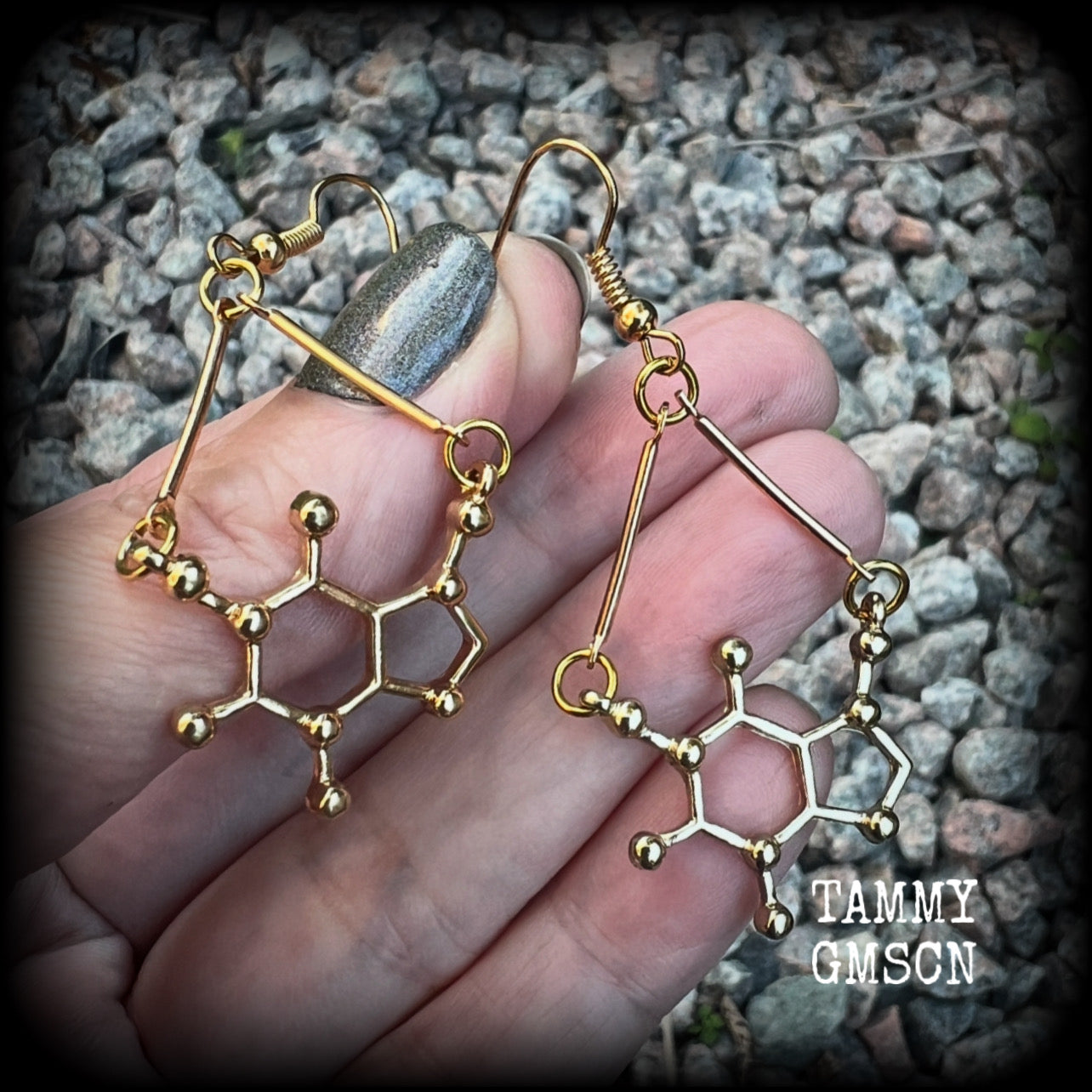 These cute champagne gold earrings feature Theobromine molecules, measuring just on 6cms from tip to tip, and weighing only a few grams each.

This pair have been made with antique gold french hooks, suitable for pierced ears.