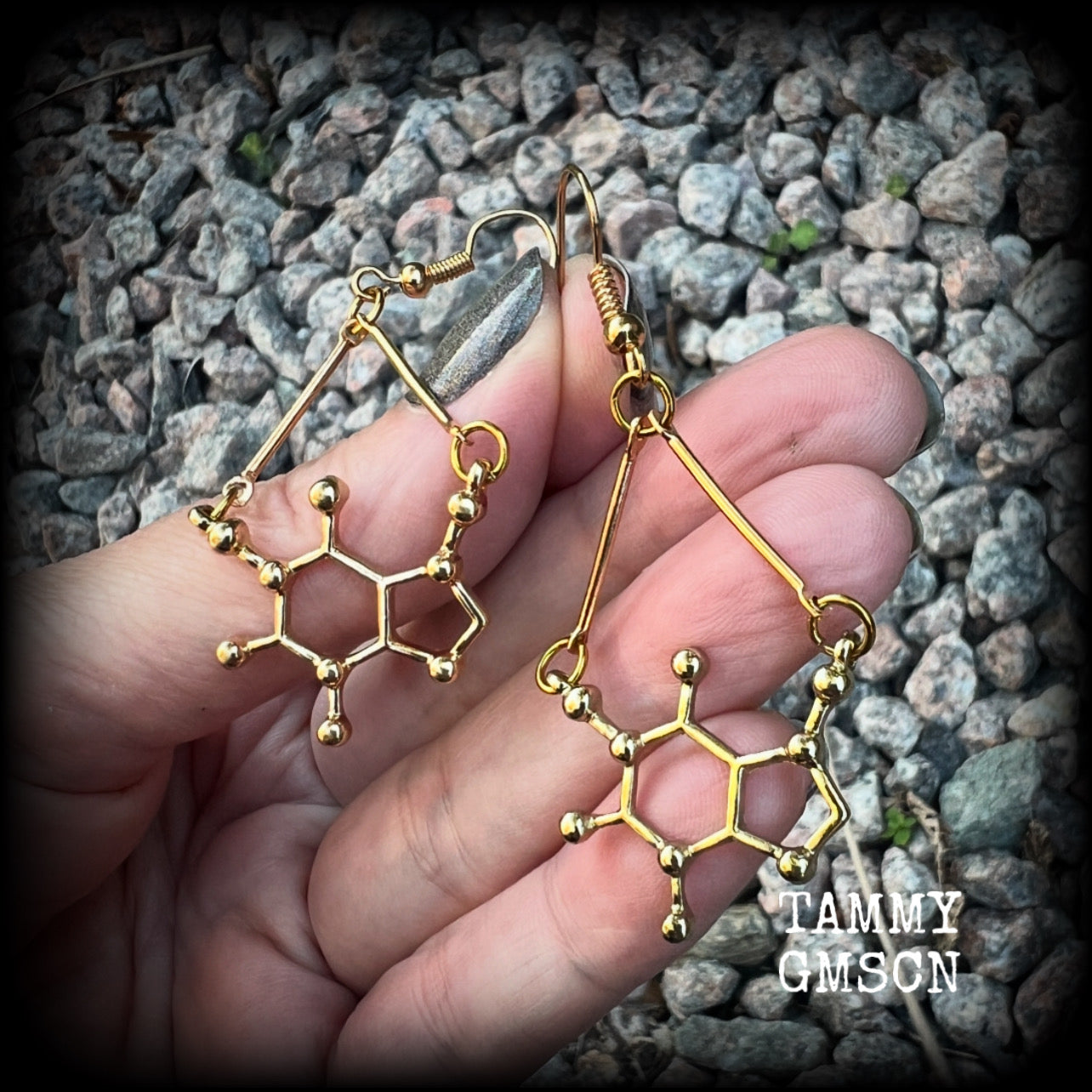 These cute champagne gold earrings feature Theobromine molecules, measuring just on 6cms from tip to tip, and weighing only a few grams each.

This pair have been made with antique gold french hooks, suitable for pierced ears.