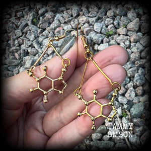 These cute champagne gold earrings feature Theobromine molecules, measuring just on 6cms from tip to tip, and weighing only a few grams each.

This pair have been made with antique gold french hooks, suitable for pierced ears.