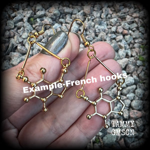 These cute champagne gold earrings feature Theobromine molecules, measuring just on 6cms from tip to tip, and weighing only a few grams each.

This pair have been made with antique gold french hooks, suitable for pierced ears.