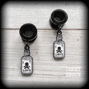 Love potions Love potion bottle Love spell Skull earrings Skull tunnels Tunnel earrings Tunnel dangles Halloween ear gauges Halloween gauged earrings Spell bottle Gothic jewelry Emo jewelry Spooky cute earrings Spooky earrings Cute tunnels Samhain