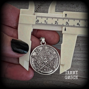 Measuring 16" when laying flat and fastening with an antique silver lobster clasp, this necklace features a two sided tibetan silver Tetragrammaton pendant. 

The pendant on this necklace measures just under 3cms across, and is not too heavy, weighing in at approx 5 grams.