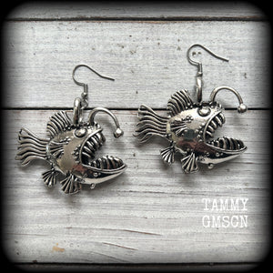 These unique earrings feature big antique silver anglerfishes, weighing 25 grams each and measuring just over 6cms from tip to tip.

This pair have been made on stainless steel french hooks, suitable for pierced ears.