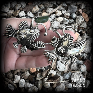 These unique earrings feature big antique silver anglerfishes, weighing 25 grams each and measuring just over 6cms from tip to tip.

This pair have been made on stainless steel french hooks, suitable for pierced ears.