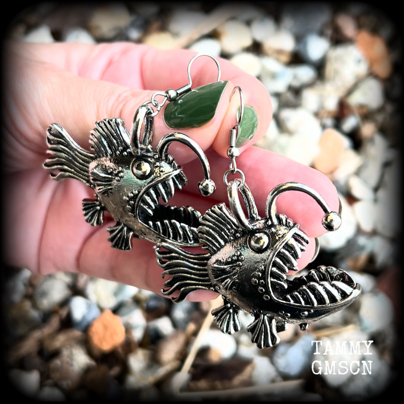 These unique earrings feature big antique silver anglerfishes, weighing 25 grams each and measuring just over 6cms from tip to tip.

This pair have been made on stainless steel french hooks, suitable for pierced ears.