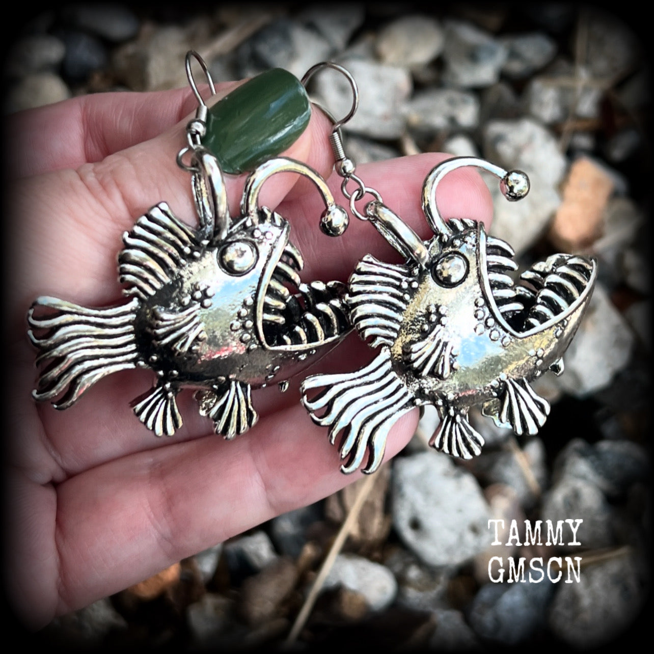 These unique earrings feature big antique silver anglerfishes, weighing 25 grams each and measuring just over 6cms from tip to tip.

This pair have been made on stainless steel french hooks, suitable for pierced ears.