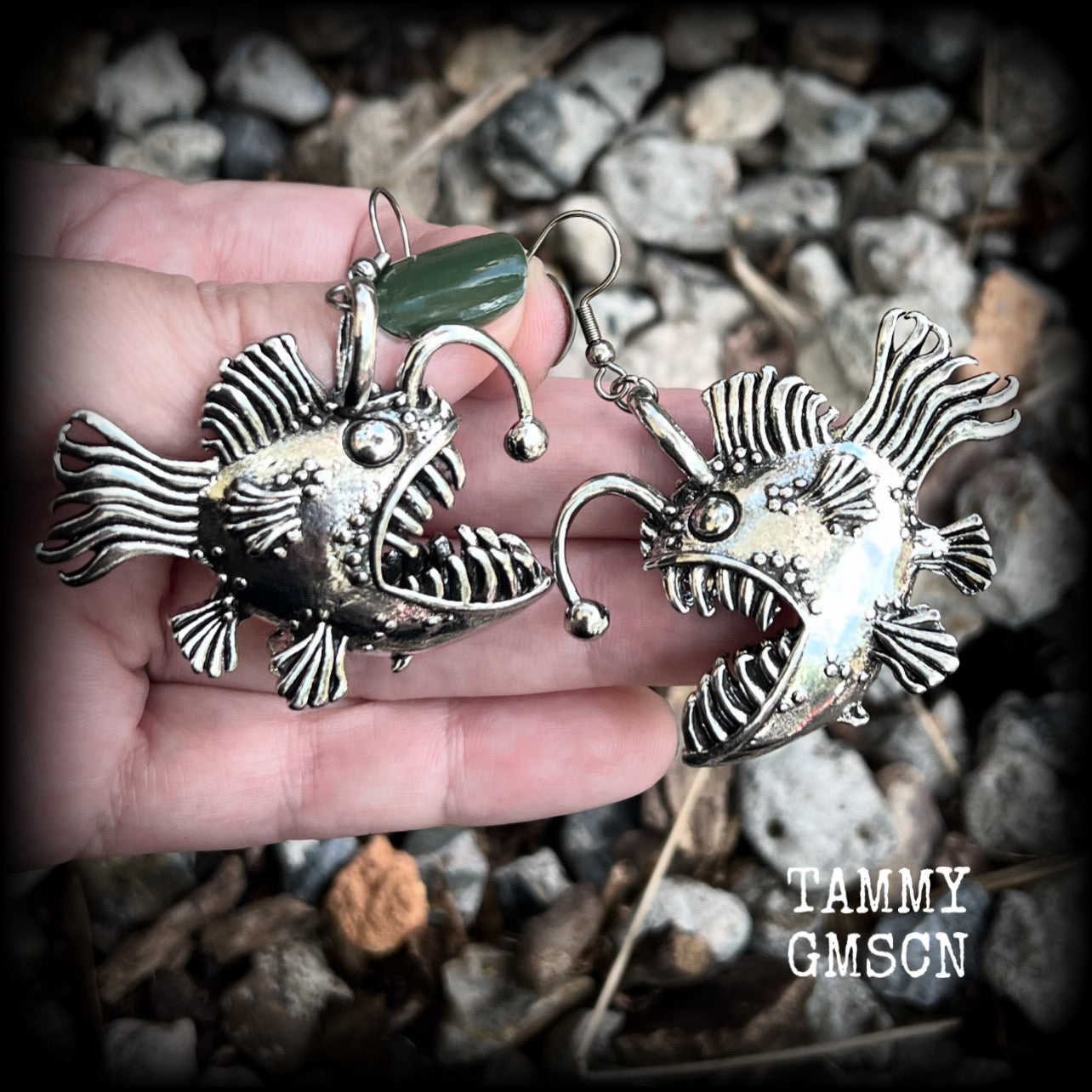 These unique earrings feature big antique silver anglerfishes, weighing 25 grams each and measuring just over 6cms from tip to tip.

This pair have been made on stainless steel french hooks, suitable for pierced ears.