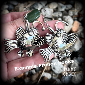 These unique earrings feature big antique silver anglerfishes, weighing 25 grams each and measuring just over 6cms from tip to tip.

This pair have been made on stainless steel french hooks, suitable for pierced ears.