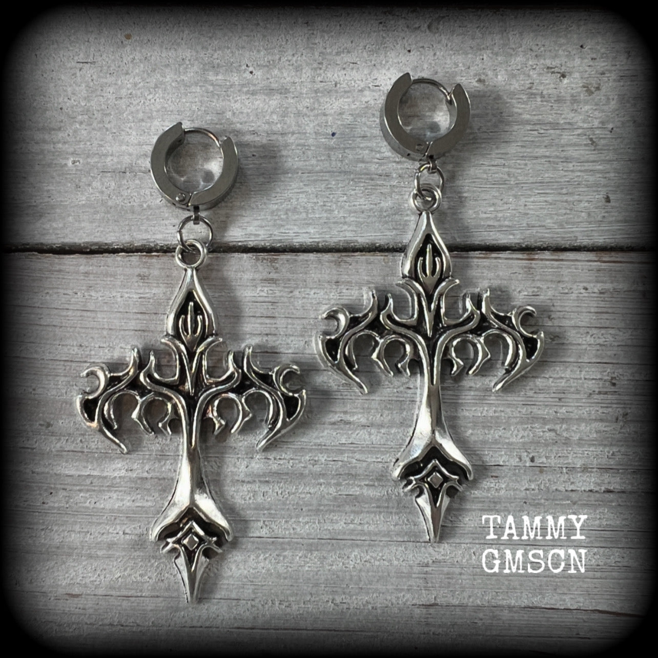 These gorgeous antique silver cyber sigil tattoo inspired cross earrings measure just over 7cms from tip to tip, and are nice and light weight, at 7 grams each.

This pair have been made on stainless steel huggies-suitable for pierced ears.