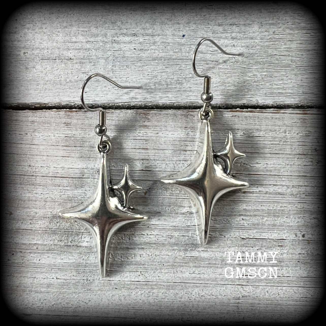 These earrings feature super retro super cute antique silver starbursts. These are light weight, weighing only a few grams each and nice and dangly, measuring just on 5cm from tip to tip.

This pair has been made on stainless steel french hooks, to be worn through pierced ears.
