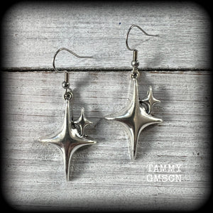 These earrings feature super retro super cute antique silver starbursts. These are light weight, weighing only a few grams each and nice and dangly, measuring just on 5cm from tip to tip.

This pair has been made on stainless steel french hooks, to be worn through pierced ears.