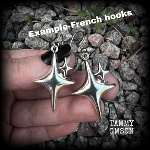 These earrings feature super retro super cute antique silver starbursts. These are light weight, weighing only a few grams each and nice and dangly, measuring just on 5cm from tip to tip.  This pair has been made on surgical steel french hooks, to be worn through pierced ears.