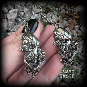 Featuring antique silver elder god Chuthulu charms, these earrings weigh approx 8 grams each, and are nice and dangly, measuring just over 6cms from tip to tip.

This pair have been made with stainless steel french hooks, suitable for pierced ears.
