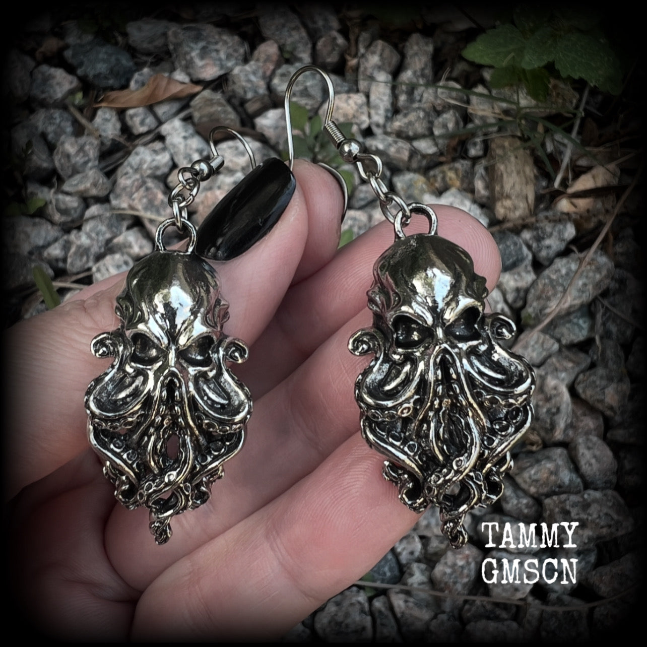 Featuring antique silver elder god Chuthulu charms, these earrings weigh approx 8 grams each, and are nice and dangly, measuring just over 6cms from tip to tip.

This pair have been made with stainless steel french hooks, suitable for pierced ears.