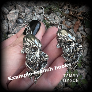Featuring antique silver elder god Chuthulu charms, these earrings weigh approx 8 grams each, and are nice and dangly, measuring just over 6cms from tip to tip.

This pair have been made with stainless steel french hooks, suitable for pierced ears.