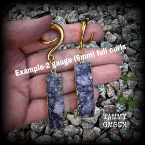 Featuring gorgeous purple druzy and antique gold crystals, these unique gauged earrings measure approx 8cms from tip to tip, and weighing approx 15 grams each.  This pair have been made on 2 gauge (6mm) titanium coated surgical steel full curl hooks, for stretched lobes.