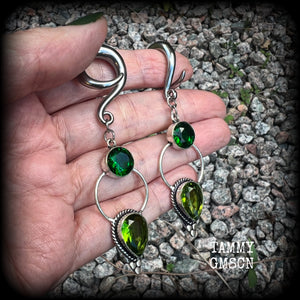 This pair of beautifully dangly earrings features gorgeous green peridot and green quartz gemstones in a boho antique silver setting, weighing approx 11grams a piece and measuring just over 8cms from tip to tip.  This pair have been made on 2 gauge (6mm) surgical steel full curl hooks, to be worn in stretched lobes.