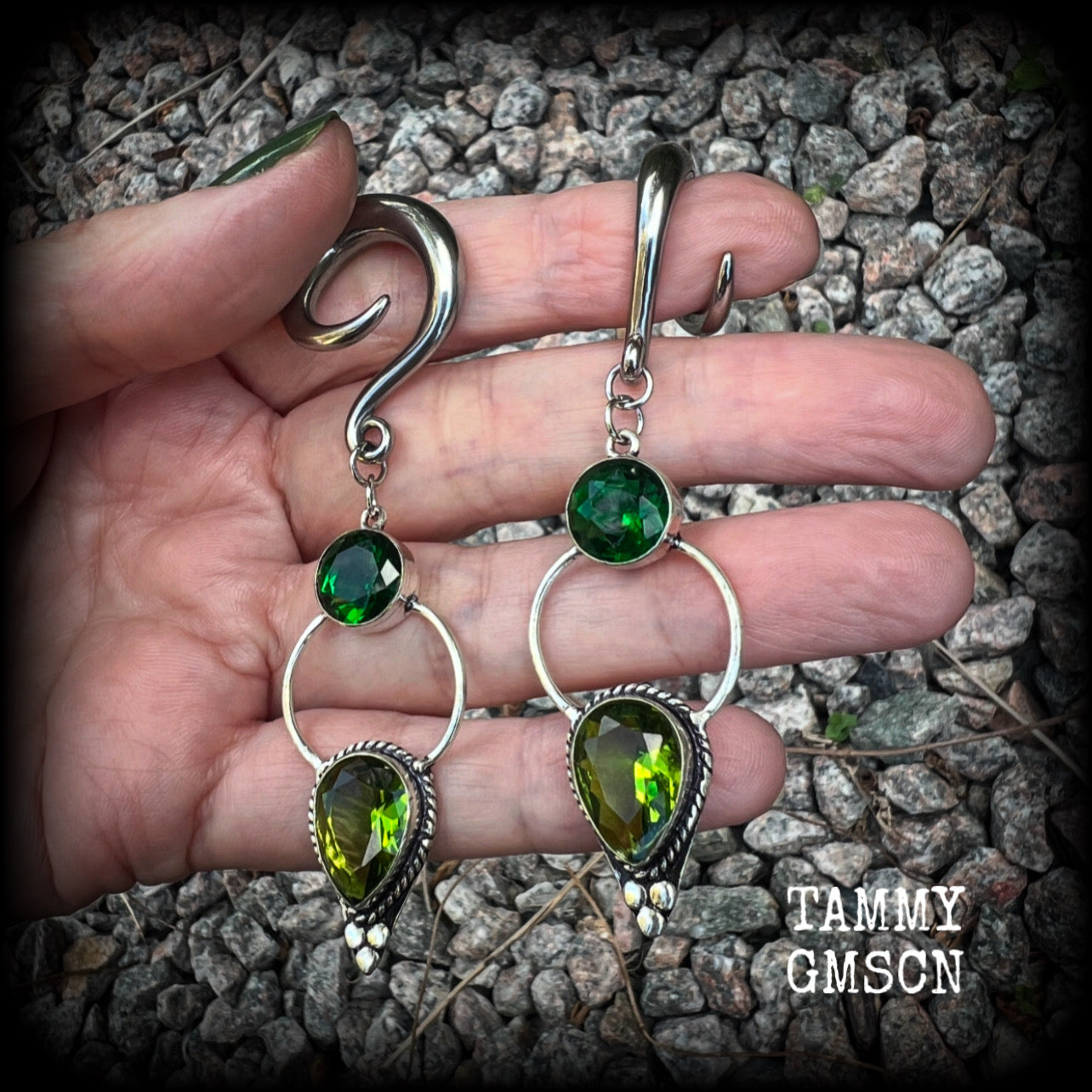 This pair of beautifully dangly earrings features gorgeous green peridot and green quartz gemstones in a boho antique silver setting, weighing approx 11grams a piece and measuring just over 8cms from tip to tip.  This pair have been made on 2 gauge (6mm) surgical steel full curl hooks, to be worn in stretched lobes.