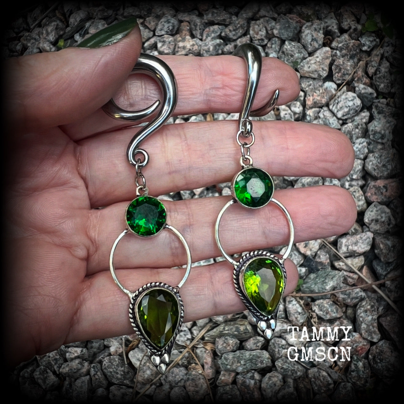 This pair of beautifully dangly earrings features gorgeous green peridot and green quartz gemstones in a boho antique silver setting, weighing approx 11grams a piece and measuring just over 8cms from tip to tip.  This pair have been made on 2 gauge (6mm) surgical steel full curl hooks, to be worn in stretched lobes.