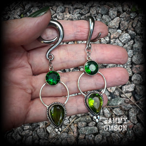 This pair of beautifully dangly earrings features gorgeous green peridot and green quartz gemstones in a boho antique silver setting, weighing approx 11grams a piece and measuring just over 8cms from tip to tip.  This pair have been made on 2 gauge (6mm) surgical steel full curl hooks, to be worn in stretched lobes.