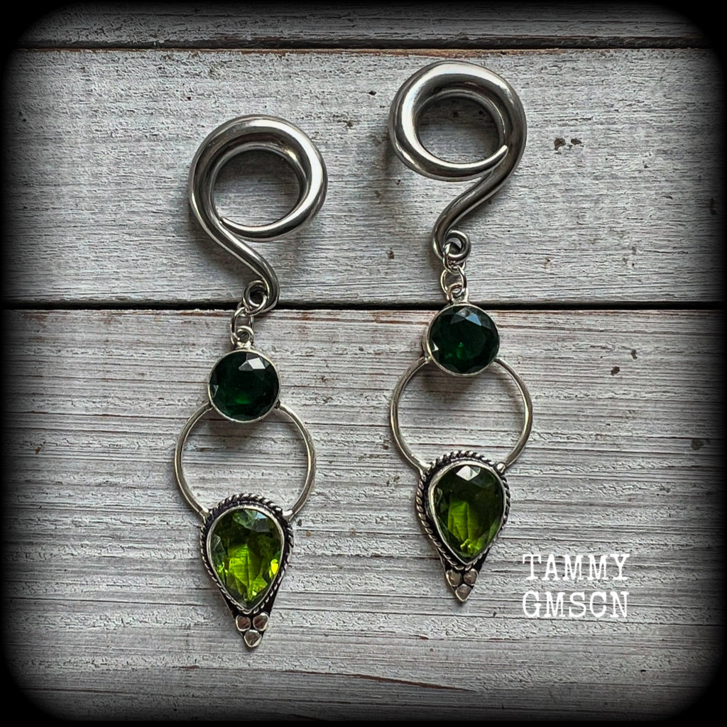 This pair of beautifully dangly earrings features gorgeous green peridot and green quartz gemstones in a boho antique silver setting, weighing approx 11grams a piece and measuring just over 8cms from tip to tip.  This pair have been made on 2 gauge (6mm) surgical steel full curl hooks, to be worn in stretched lobes.