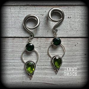 This pair of beautifully dangly earrings features gorgeous green peridot and green quartz gemstones in a boho antique silver setting, weighing approx 11grams a piece and measuring just over 8cms from tip to tip.  This pair have been made on 2 gauge (6mm) surgical steel full curl hooks, to be worn in stretched lobes.