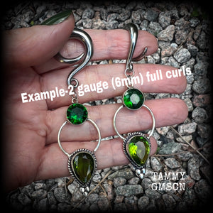 This pair of beautifully dangly earrings features gorgeous green peridot and green quartz gemstones in a boho antique silver setting, weighing approx 11grams a piece and measuring just over 8cms from tip to tip.  This pair have been made on 2 gauge (6mm) surgical steel full curl hooks, to be worn in stretched lobes.