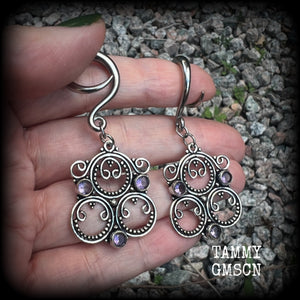 These gorgeous gauged earrings feature beautiful purple facet amethyst gemstones in an antique silver gypsy boho style setting, measuring just on 6cms from tip to tip, and weighing approx 6 grams each, not too heavy...  This pair have been made on 6 gauge (6mm) surgical steel full curls-suitable for stretched lobes.