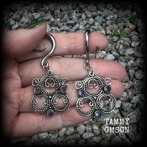 These gorgeous gauged earrings feature beautiful purple facet amethyst gemstones in an antique silver gypsy boho style setting, measuring just on 6cms from tip to tip, and weighing approx 6 grams each, not too heavy...  This pair have been made on 6 gauge (6mm) surgical steel full curls-suitable for stretched lobes.