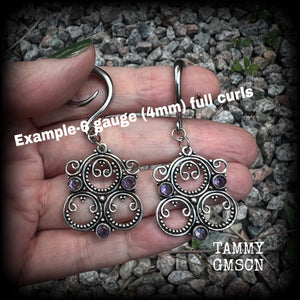 These gorgeous gauged earrings feature beautiful purple facet amethyst gemstones in an antique silver gypsy boho style setting, measuring just on 6cms from tip to tip, and weighing approx 6 grams each, not too heavy...  This pair have been made on 6 gauge (6mm) surgical steel full curls-suitable for stretched lobes.