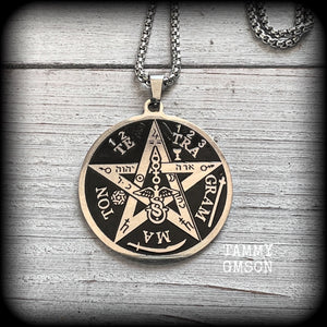 Measuring 16" when laying flat and fastening with an antique silver lobster clasp, this necklace features a stainless steel silver and black Tetragrammaton pendant.

The pendant on this necklace measures approx 3.5cms across, and is not too heavy, weighing in at approx 5 grams.