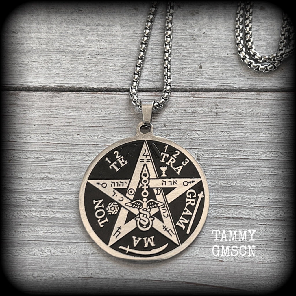 Measuring 16" when laying flat and fastening with an antique silver lobster clasp, this necklace features a stainless steel silver and black Tetragrammaton pendant.

The pendant on this necklace measures approx 3.5cms across, and is not too heavy, weighing in at approx 5 grams.